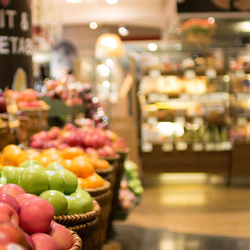 baskets of apples and fruit in grocery store